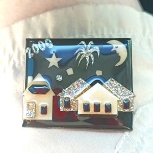 Lucinda House Pin with and Christmas vibe has a golden-orange backgrou